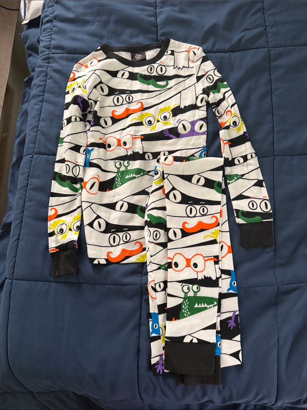Playful Monster Stripe Kids Pajama Set in White with Colorful Accents